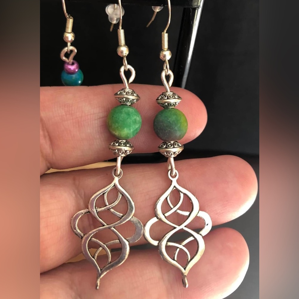Celtic swirl hanging earrings with green beads. Artisan handmade with love.